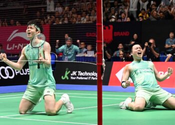 AARON Chia-Soh Wooi Yik ketika meraikan kemenangan mereka ke atas pasangan Korea Selatan, Kim Won Ho-Seo Seung Jae pada perlawanan akhir Terbuka Singapura, baru-baru ini. - AFP