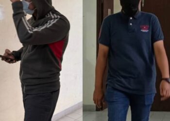 MOHAMAD Irwan Ason (kiri) dan Mohd. Effendy Mat Desa ketika tiba di Kompleks Mahkamah Butterworth, Pulau Pinang hari ini.