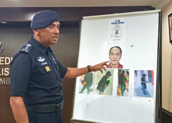 ALZFANY Ahmad menunjukkan gambar Yeoh Hock Sun yang dipercayai terlibat dalam kejadian letupan di Nilai pada 22 Disember lalu.UTUSAN/NOR SHAFIQAH MOHD. GHAZALI