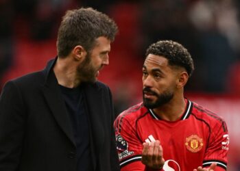 Michael Carrick mempunyia hubungan yang baik dengan pemain-pemain Manchester United. - AFP