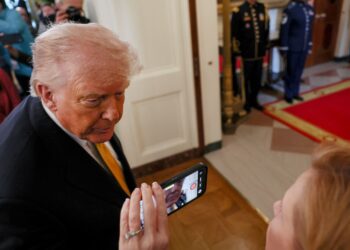 DONALD TRUMP (kiri). - AFP