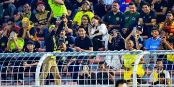 PARA Penyokong Harimau Malaya yang hadir ke Stadium Bolasepak Kuala Lumpur, Cheras ketika aksi Malaysia menentang Laos, minggu lalu.-IHSAN FAM